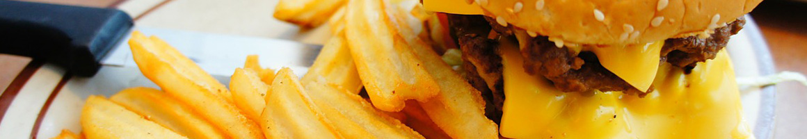 Eating Burger at Tops Choice Hamburgers restaurant in Pensacola, FL.